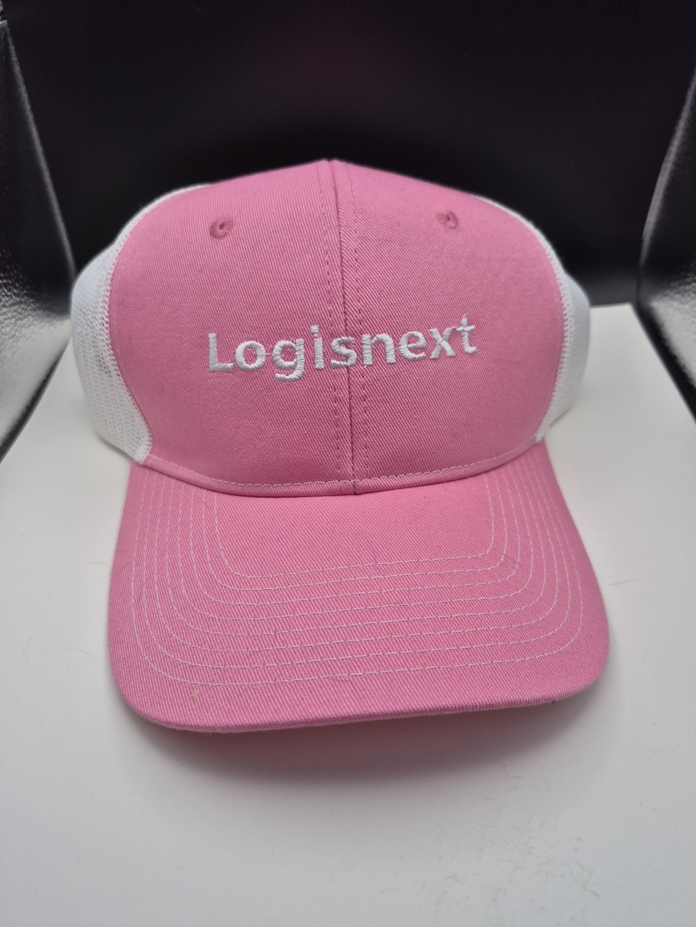 Port Authority Pink and White Logisnext Trucker Hat